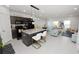 Modern kitchen featuring granite countertops, stainless steel appliances, and an island with seating at 3857 Hampstead Ln, Lakeland, FL 33810