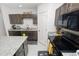 Updated kitchen featuring black appliances, granite countertops, and modern fixtures at 3857 Hampstead Ln, Lakeland, FL 33810