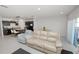 Open-concept living room and kitchen with a large island and stainless steel appliances at 3857 Hampstead Ln, Lakeland, FL 33810