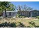 Charming home exterior with manicured lawn and tasteful landscaping enhances curb appeal at 3880 Cleveland Heights Blvd, Lakeland, FL 33813