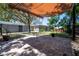 Backyard features a large brick paver patio with a covered pergola area for entertaining at 3880 Cleveland Heights Blvd, Lakeland, FL 33813