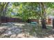 Large backyard offers ample space for recreation and relaxation under the shade of mature trees at 3880 Cleveland Heights Blvd, Lakeland, FL 33813