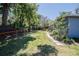 Lush backyard with mature trees and thoughtful landscaping bordering the home at 3880 Cleveland Heights Blvd, Lakeland, FL 33813