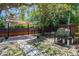 Inviting backyard features a cozy covered patio and a spacious yard, ideal for outdoor entertaining at 3880 Cleveland Heights Blvd, Lakeland, FL 33813