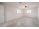 Spacious bedroom with tile flooring, two windows, and a ceiling fan at 3880 Cleveland Heights Blvd, Lakeland, FL 33813