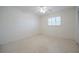 Bright bedroom with speckled floors, a ceiling fan, and a window at 3880 Cleveland Heights Blvd, Lakeland, FL 33813