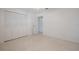 Clean bedroom with a built in closet, neutral walls, and patterned flooring at 3880 Cleveland Heights Blvd, Lakeland, FL 33813