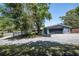 Exterior view of a home with a large front yard and a convenient two-car garage at 3880 Cleveland Heights Blvd, Lakeland, FL 33813