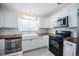 Contemporary kitchen with white cabinets, stainless steel appliances, and stylish countertops at 3880 Cleveland Heights Blvd, Lakeland, FL 33813