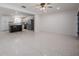 Spacious living room leading to the updated kitchen featuring stainless steel appliances and modern decor at 3880 Cleveland Heights Blvd, Lakeland, FL 33813