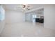 Open concept living room leading to the well-appointed kitchen with stainless steel appliances and neutral tones at 3880 Cleveland Heights Blvd, Lakeland, FL 33813