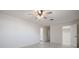 Bright main bedroom featuring tile flooring, a ceiling fan, and an ensuite bathroom at 3880 Cleveland Heights Blvd, Lakeland, FL 33813