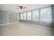 Enclosed sun room with tile flooring, gray walls, and plenty of natural light at 3880 Cleveland Heights Blvd, Lakeland, FL 33813
