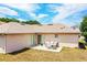 Backyard featuring a concrete patio with outdoor seating and a well-maintained lawn at 3942 Warbler Dr, Winter Haven, FL 33880