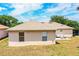 A beautiful view of the home's backyard with a patio area and plenty of space for outdoor activities and relaxation at 3942 Warbler Dr, Winter Haven, FL 33880