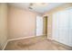 This bedroom features carpet floors and a closet for storage at 3942 Warbler Dr, Winter Haven, FL 33880
