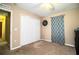 This bedroom features carpet floors, a ceiling fan, and a closet for storage at 3942 Warbler Dr, Winter Haven, FL 33880