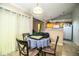 Charming dining area features a pendant light, tiled floors and is adjacent to the kitchen at 3942 Warbler Dr, Winter Haven, FL 33880