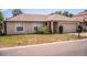 Cozy single-story home featuring a 2-car garage and tidy landscaping with manicured lawn at 3942 Warbler Dr, Winter Haven, FL 33880