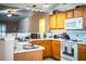 Functional kitchen featuring wooden cabinets and modern appliances at 3942 Warbler Dr, Winter Haven, FL 33880