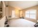 Spacious living room with neutral walls and abundant natural light from a window at 3942 Warbler Dr, Winter Haven, FL 33880