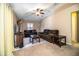 Comfortable living room features plush seating, a ceiling fan, and natural light at 3942 Warbler Dr, Winter Haven, FL 33880