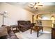 Cozy living room with neutral tones, comfortable seating and views into the kitchen at 3942 Warbler Dr, Winter Haven, FL 33880