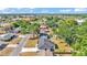 Aerial view of neighborhood with tree lined streets and well maintained lawns at 4028 S Wellington Dr, Lakeland, FL 33813