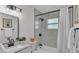 Bathroom featuring a shower-tub combination, black accents, and sleek fixtures at 4028 S Wellington Dr, Lakeland, FL 33813