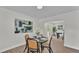 Cozy dining room features hardwood floors, modern art, modern lighting and adjacent outdoor views at 4028 S Wellington Dr, Lakeland, FL 33813