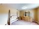 Bedroom featuring carpet, furniture, and a window at 410 Orange St, Bradley, FL 33835