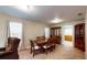 Inviting dining room featuring a classic wooden table set and china cabinet, perfect for Gathering meals at 410 Orange St, Bradley, FL 33835