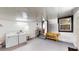 View of a garage including laundry appliances, utility sink, workbench, and access to house at 410 Orange St, Bradley, FL 33835