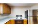 Bright kitchen featuring a stove, stainless steel refrigerator, and laminate countertops at 410 Orange St, Bradley, FL 33835