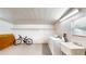 Bright laundry room with modern appliances, sink, window, overhead lights and storage with space for a bike at 410 Orange St, Bradley, FL 33835