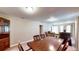 Open-concept room with dining area connected to a cozy living space with comfortable seating at 410 Orange St, Bradley, FL 33835
