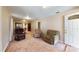 Open-concept living room with comfortable seating and natural light at 410 Orange St, Bradley, FL 33835