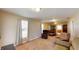 Spacious living room featuring neutral walls, carpet flooring, and abundant natural light at 410 Orange St, Bradley, FL 33835