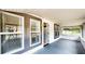 Inviting screened porch featuring an open doorway and an abundance of natural light at 410 Orange St, Bradley, FL 33835