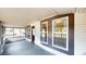 Covered porch featuring neutral tones, multiple windows, and a cozy ambiance at 410 Orange St, Bradley, FL 33835