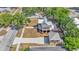 Two-story home with detached garage and long driveway, offering modern comfort and convenience with metal roof and inviting front porch at 410 S Broadway Ave, Bartow, FL 33830