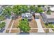 Expansive two-story house with long driveway, detached two-car garage, and mature trees enhancing the property's privacy and appeal at 410 S Broadway Ave, Bartow, FL 33830