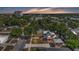 Charming neighborhood featuring a two-story home with mature trees providing shade and surrounding the home with beautiful greenery at 410 S Broadway Ave, Bartow, FL 33830