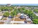 Aerial view showcasing the charming neighborhood with tree-lined streets surrounding the two-story home at 410 S Broadway Ave, Bartow, FL 33830