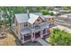 Two-story home with inviting covered porch and spacious detached garage, blending classic charm with modern convenience at 410 S Broadway Ave, Bartow, FL 33830