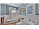 This bathroom offers a clawfoot tub, classic fixtures, and wainscoting at 410 S Broadway Ave, Bartow, FL 33830