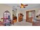 Bedroom with vintage furniture, soft carpet, and access to more rooms at 410 S Broadway Ave, Bartow, FL 33830