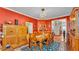 The warm and inviting dining room featuring an ornate chandelier and rustic-style decor at 410 S Broadway Ave, Bartow, FL 33830