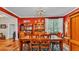 Dining room with hardwood floors, and ornate china cabinet, illuminated by natural light from the window at 410 S Broadway Ave, Bartow, FL 33830