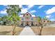 Charming two-story home features a large front porch and a balcony, creating an inviting and classic curb appeal at 410 S Broadway Ave, Bartow, FL 33830